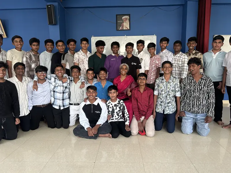 A group of STC students with a teacher in an STC classroom