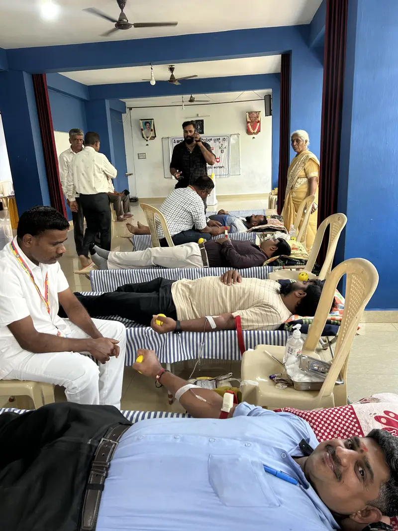 Volunteers lying on beds giving blood at the Trust's blood donation camp