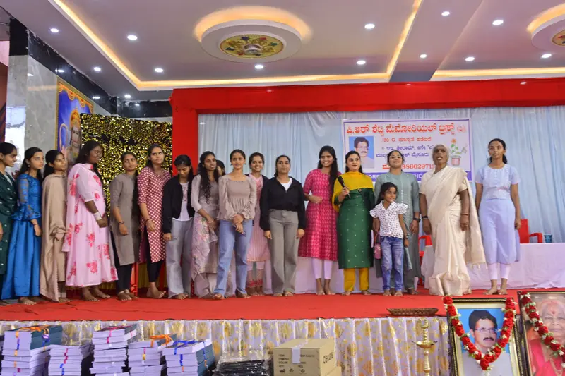 A group of students on stage with Sujatha R Shetty at the Annual Donation Event